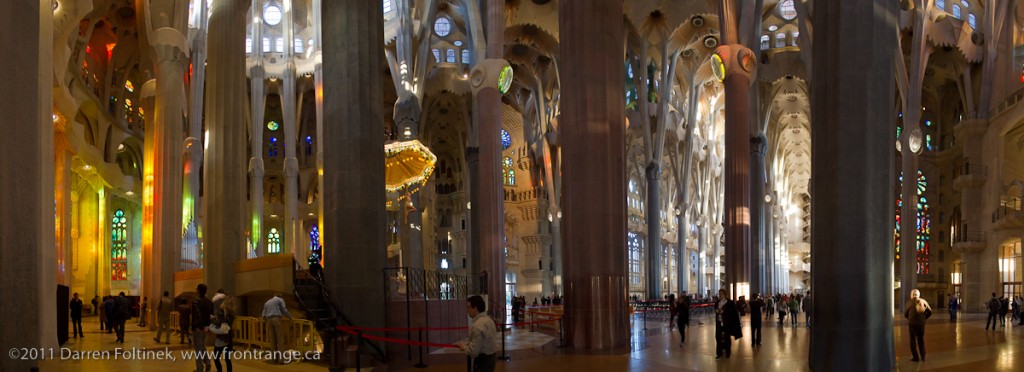 Interior of Gaudi's masterpiece, the Sangrada Familia, illuminated with late afternoon light.