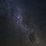 Milky Way, showing the huge Carina Nebula (pink region at upper-left) and the Southern Cross (lower center)