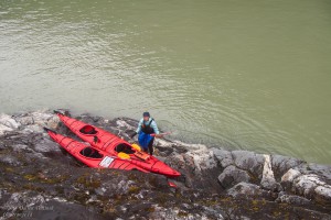 Julia with kayaks on the rocks