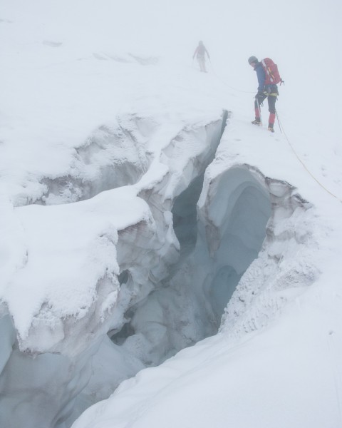 Barend peering into a crevasse on the Tusk glacier