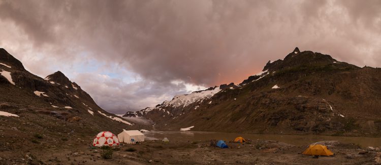 Stormy skies make for a beautiful sunset over camp