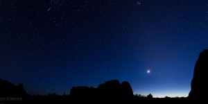 A thin, crescent Moon, with Venus and Mercury just about to set. Arches National Park.