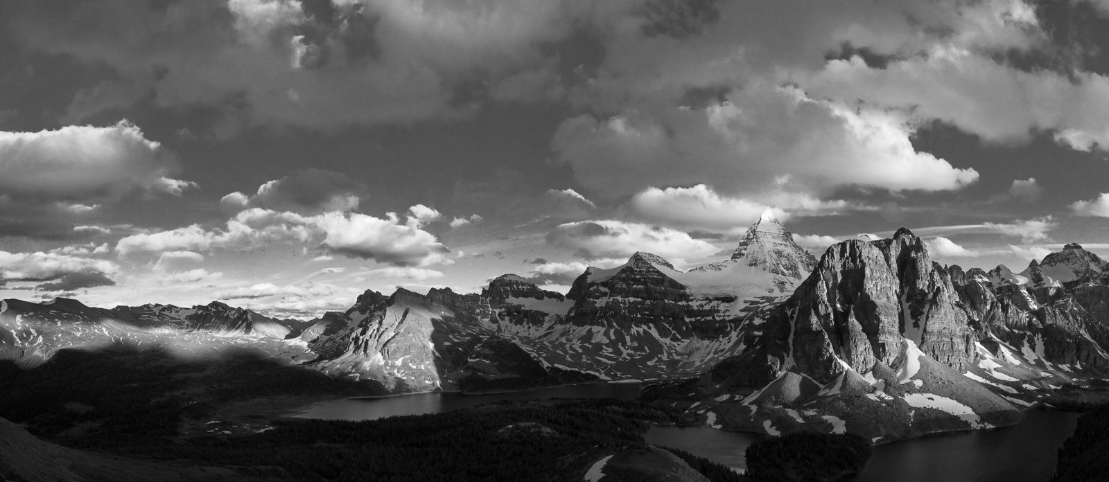 Sunburst peak and Assiniboine group at sunset. High-contrast black and white.