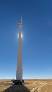 The Westy dwarfed by a windmill