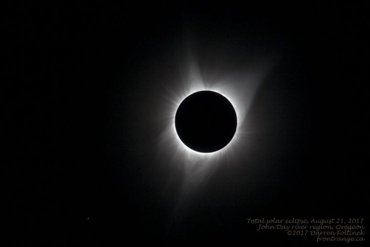Totality. The corona glows behind the lunar disk.  400mm lens, 50% crop.