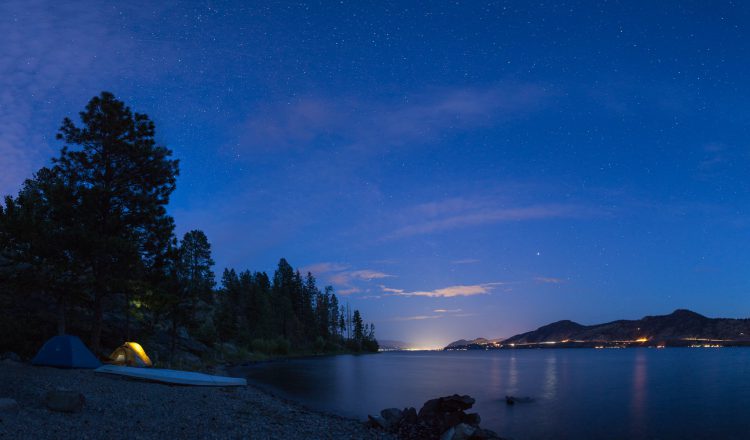 Clear night sky over Cove camp, with the glow of Penticton on the horizon.